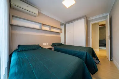 Uma cama ou camas num quarto em Apartamento 308B – Edifício Boulevard em Bombinhas