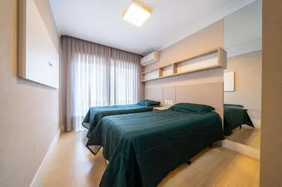 Uma cama ou camas num quarto em Apartamento 308B – Edifício Boulevard em Bombinhas