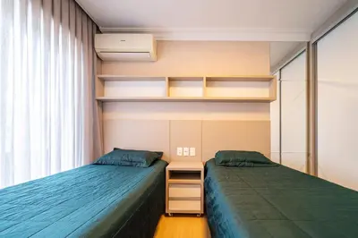 Uma cama ou camas num quarto em Apartamento 308B – Edifício Boulevard em Bombinhas