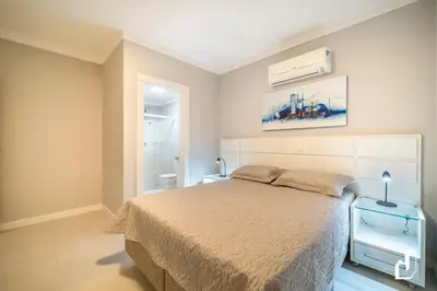 Uma cama ou camas num quarto em Apartamento com 02 dormitórios