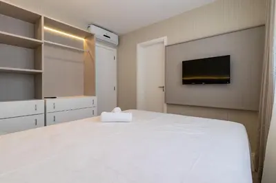 Uma cama ou camas num quarto em Apartamento com Vista Mar em Condomínio de Luxo