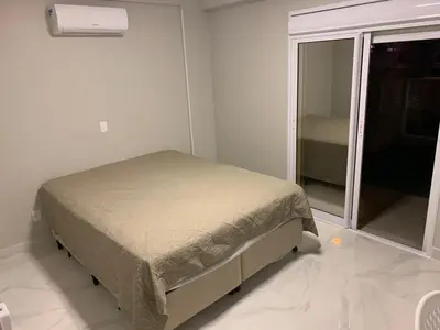 Uma cama ou camas num quarto em Lumini Residence