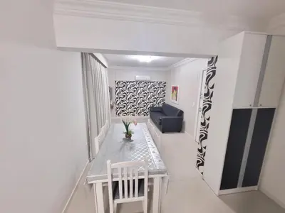 Uma área de estar em Apartamento Rota do Mar