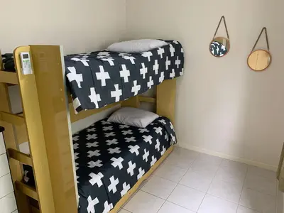 Uma cama ou camas num quarto em Ilha de Molokini Centro Bombinhas -SC