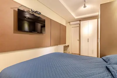 Uma cama ou camas num quarto em Apartamento em Condo com Piscina e Jacuzzi - Boulevard