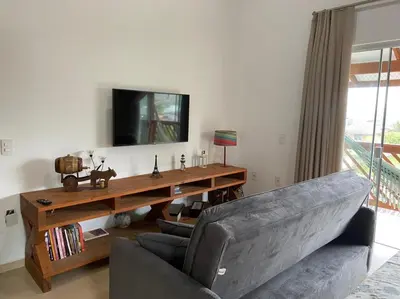 Uma televisão e/ou sistema de entretenimento em Studio Recanto Beach Itapema