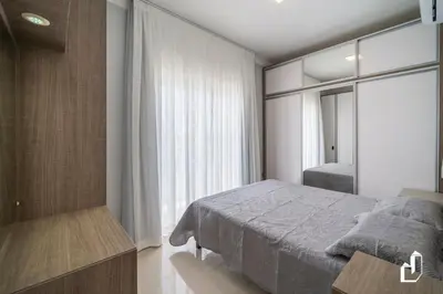 Uma cama ou camas num quarto em Cobertura duplex com vista para o mar e jacuzzi