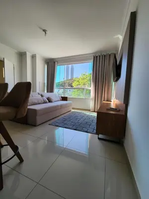 Uma área de estar em Apartamento Balneário Camboriú