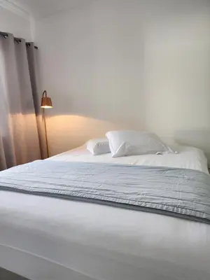 Uma cama ou camas num quarto em Apartamento Balneário Camboriú