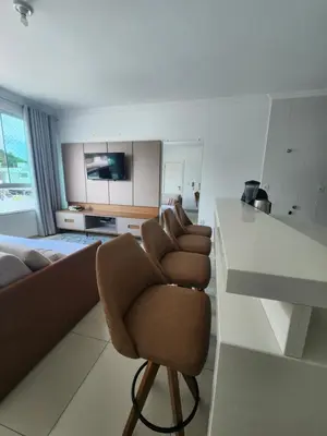 Uma televisão e/ou sistema de entretenimento em Apartamento Balneário Camboriú