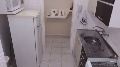 A cozinha ou kitchenette de Apartamento quadra mar