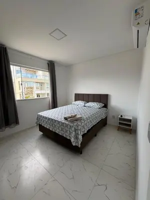 Uma cama ou camas num quarto em Nino's Residence - 150m da Praia de Mariscal