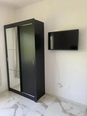 Uma televisão e/ou sistema de entretenimento em Nino's Residence - 150m da Praia de Mariscal