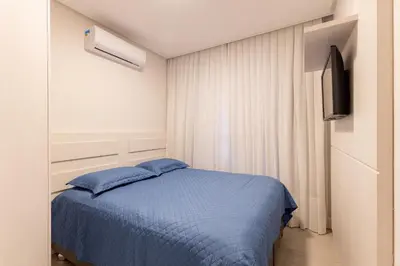 Uma cama ou camas num quarto em Porto Madero - Apartamento em Condomínio com Piscina e Academia