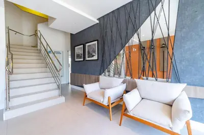 Uma área de estar em Porto Madero - Apartamento em Condomínio com Piscina e Academia
