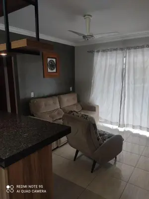 Uma área de estar em Casa amanda