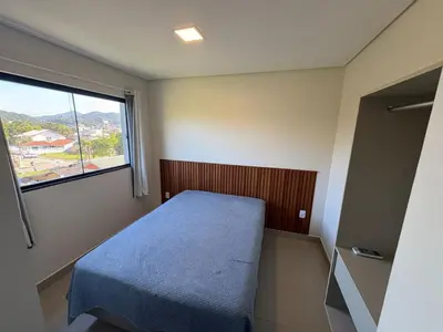 Uma cama ou camas num quarto em Residencial Brisa do Mar