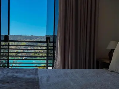 Uma cama ou camas num quarto em Casa com vista para o mar em Governador Celso Ramos