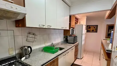 A cozinha ou kitchenette de Apto Almeida e Moraes Pé na Areia BC 2 vagas de garagem