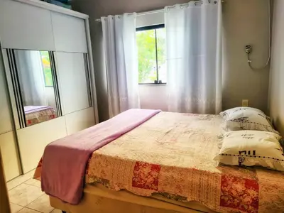 Uma cama ou camas num quarto em Casa de praia no Estaleirinho BC