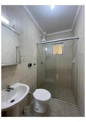 Uma casa de banho em AP com Piscina em Porto Belo