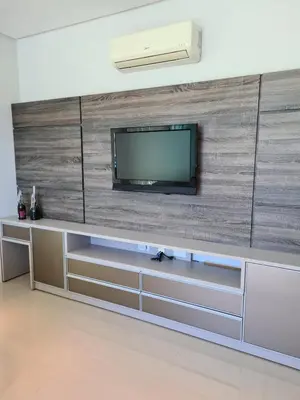 Uma televisão e/ou sistema de entretenimento em Cobertura com Piscina 50 mt do Mar