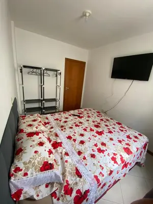 Uma cama ou camas num quarto em Apartamento Aconchegante