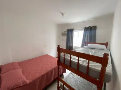 Uma cama ou camas num quarto em Apartamento Aconchegante