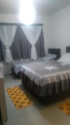 Uma cama ou camas num quarto em Hospede Mar Bombinhas
