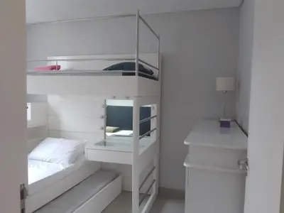 Uma cama ou camas num quarto em Apartamento palmas 2 dormitorios