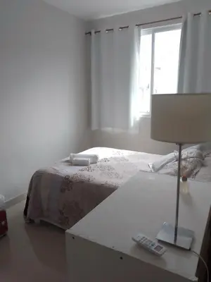 Uma cama ou camas num quarto em Apartamento palmas 2 dormitorios