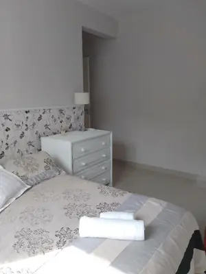 Uma cama ou camas num quarto em Apartamento palmas 2 dormitorios