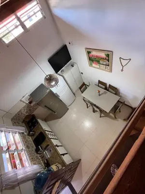 Uma televisão e/ou sistema de entretenimento em Casa na Praia de Palmas
