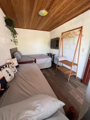 Uma cama ou camas num quarto em Casa na Praia de Palmas