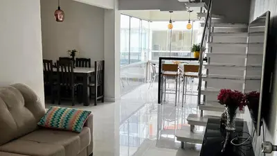 Uma área de estar em Duplex Pé na Areia - Vista para o Mar - 08 Pessoas