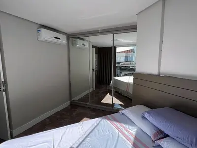Uma cama ou camas num quarto em Duplex Pé na Areia - Vista para o Mar - 08 Pessoas