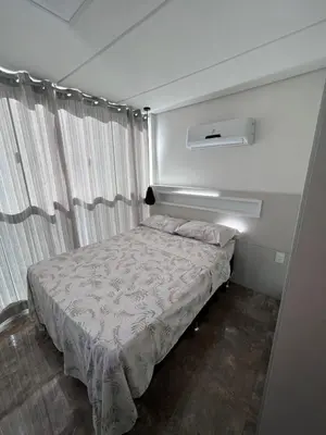 Uma cama ou camas num quarto em Duplex Pé na Areia - Vista para o Mar - 08 Pessoas