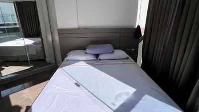 Uma cama ou camas num quarto em Duplex Pé na Areia - Vista para o Mar - 08 Pessoas