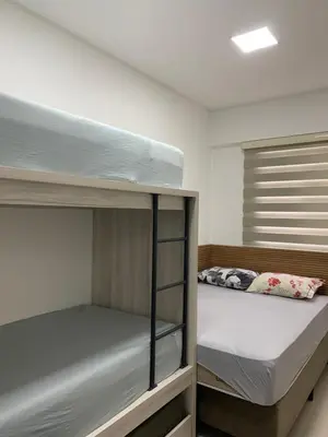 Uma cama ou camas num quarto em Apto aconchegante e elegante Morretes itapema