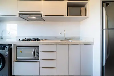 A cozinha ou kitchenette de Aluguel Apartamento 2 Suítes Bombinhas