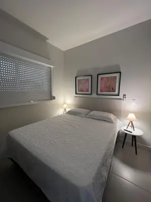 Uma cama ou camas num quarto em Apto Praia de Palmas