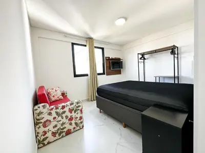 Uma cama ou camas num quarto em Bombinhas Monserrate