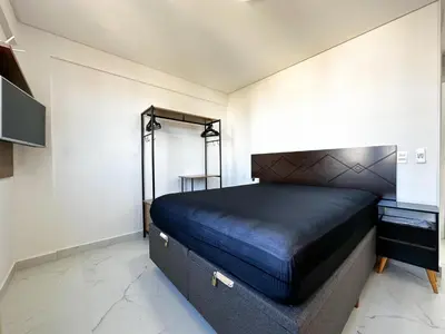 Uma cama ou camas num quarto em Bombinhas Monserrate