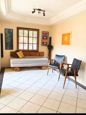 Uma área de estar em Cabelera's House