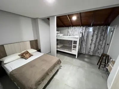 Uma cama ou camas num quarto em Apartamento Frente Mar Vista Lateral