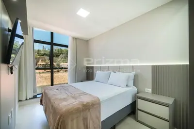 Uma cama ou camas num quarto em 303 Bl 03 - WaldGarten Bombinhas - 50 m do Mar - Condomínio de Alto Padrão - Piscina - Academia - Salão de jogos
