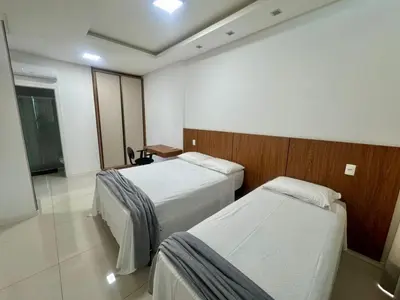 Uma cama ou camas num quarto em Apto Almeida e Moraes 3 Suítes vista mar
