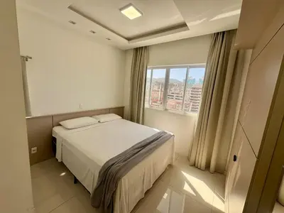 Uma cama ou camas num quarto em Apto Almeida e Moraes 3 Suítes vista mar