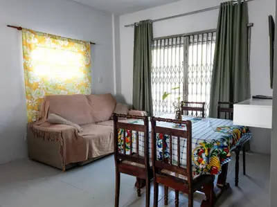 Uma área de estar em Apartamento Canto Da Praia Itapema