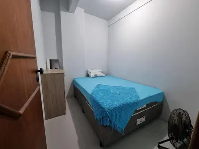 Uma cama ou camas num quarto em Apartamento Canto Da Praia Itapema